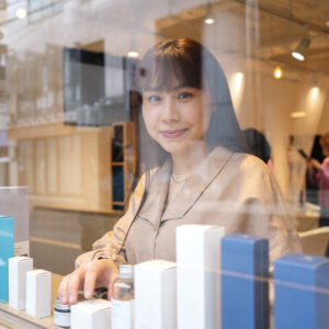 woman getting display window japanese hairdressers ready